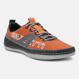 Orange comfort low-top sneakers by bugatti, featuring grey accents, a textured upper, and contrast stitching.