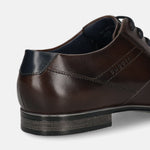 Brown leather derby formal shoe by bugatti with navy heel accent and textured sole, shown in a close-up back angle view.