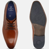 Cognac leather formal shoes by bugatti, showing top view and sole with brand logo pattern.