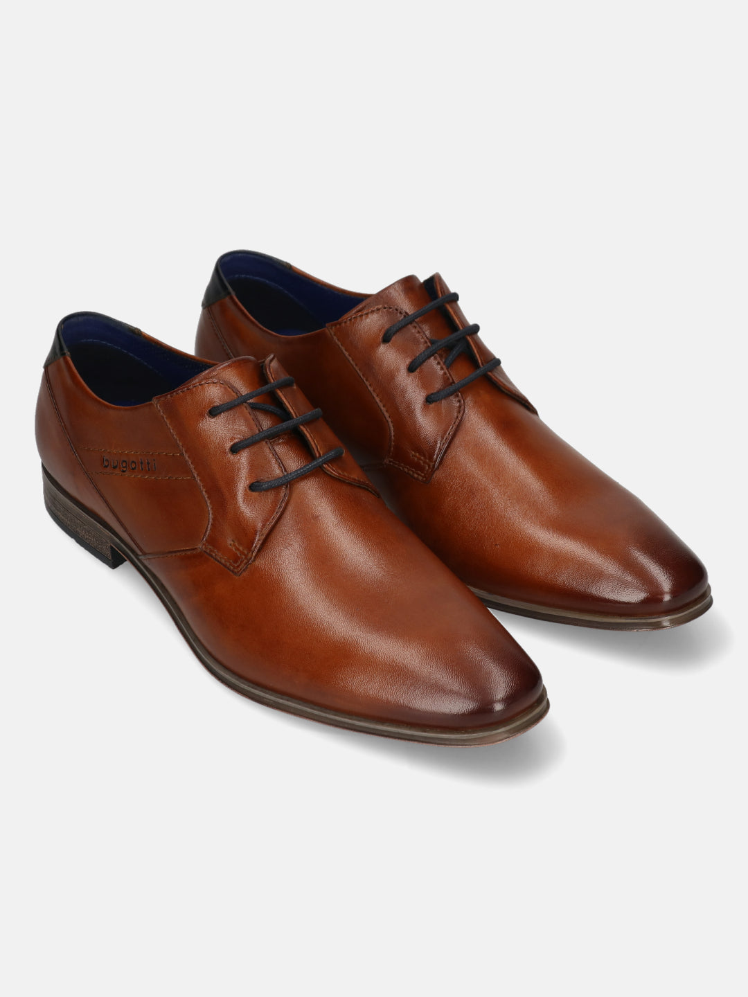 Cognac leather derby dress shoes by Bugatti, with black laces and navy blue interior lining.