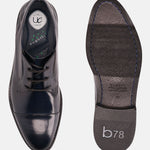 Dark blue leather formal shoes by bugatti, shown with visible sole and comfort insole.