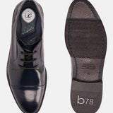 Dark blue leather formal shoes by bugatti, shown with visible sole and comfort insole.