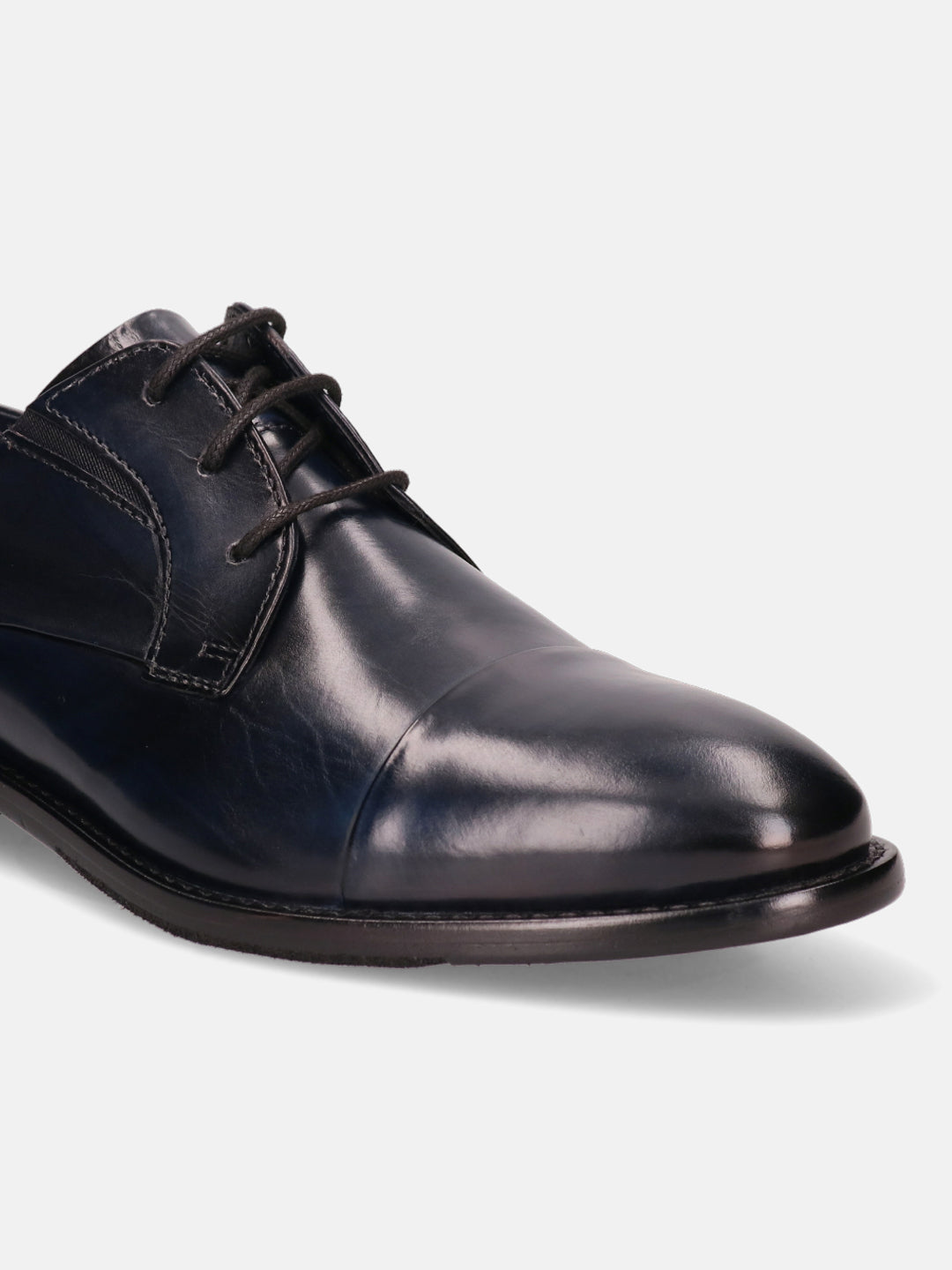 Dark blue leather derby dress shoe by Bugatti with black laces and a cap toe.