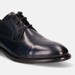Dark blue leather derby dress shoe by Bugatti with black laces and a cap toe.