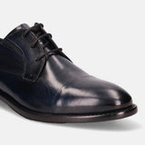 Dark blue leather derby dress shoe by Bugatti with black laces and a cap toe.