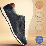 Dark blue leather sneakers by bugatti with a zipper closure and decorative perforations.