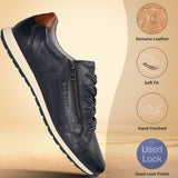 Dark blue leather sneakers by bugatti with a zipper closure and decorative perforations.