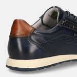 Cropped view of a bugatti Thorello sneaker in dark blue premium leather with a brown heel cap and side zipper.