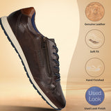 Brown leather comfort sneakers by bugatti with side zipper and contrast blue laces and sole.