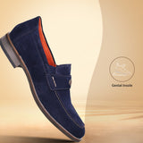A blue Men's bugatti Penny Loafer featuring a round apron toe, moulded  heel. Made from suede leather with a durable tr outsole, this slip-on design offers both style and comfort.