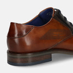 Cognac leather formal shoe by bugatti with layered heel and subtle Bugatti text pattern.