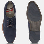 Dark blue suede comfort derby shoes by bugatti with perforated texture and lace-up closure, sole view visible.