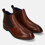 bugatti Amros cognac leather Chelsea boots with blue interior, zipper, and heel pull tab.