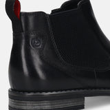 back view of a black bugatti premium leather Chelsea boot, featuring a red-lined pull tab and elastic side panel.
