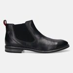 Side view of a black, leather bugatti Chelsea boot featuring elastic side panels and a small, red pull tab.
