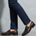 bugatti Theobaldo dark brown premium leather penny loafers, complemented by navy dress pants.
