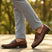 Men's Bugatti penny loafer cognac leather shoes with a pointed toe and apron toe featuring a moulded heel , a tpr outsole.