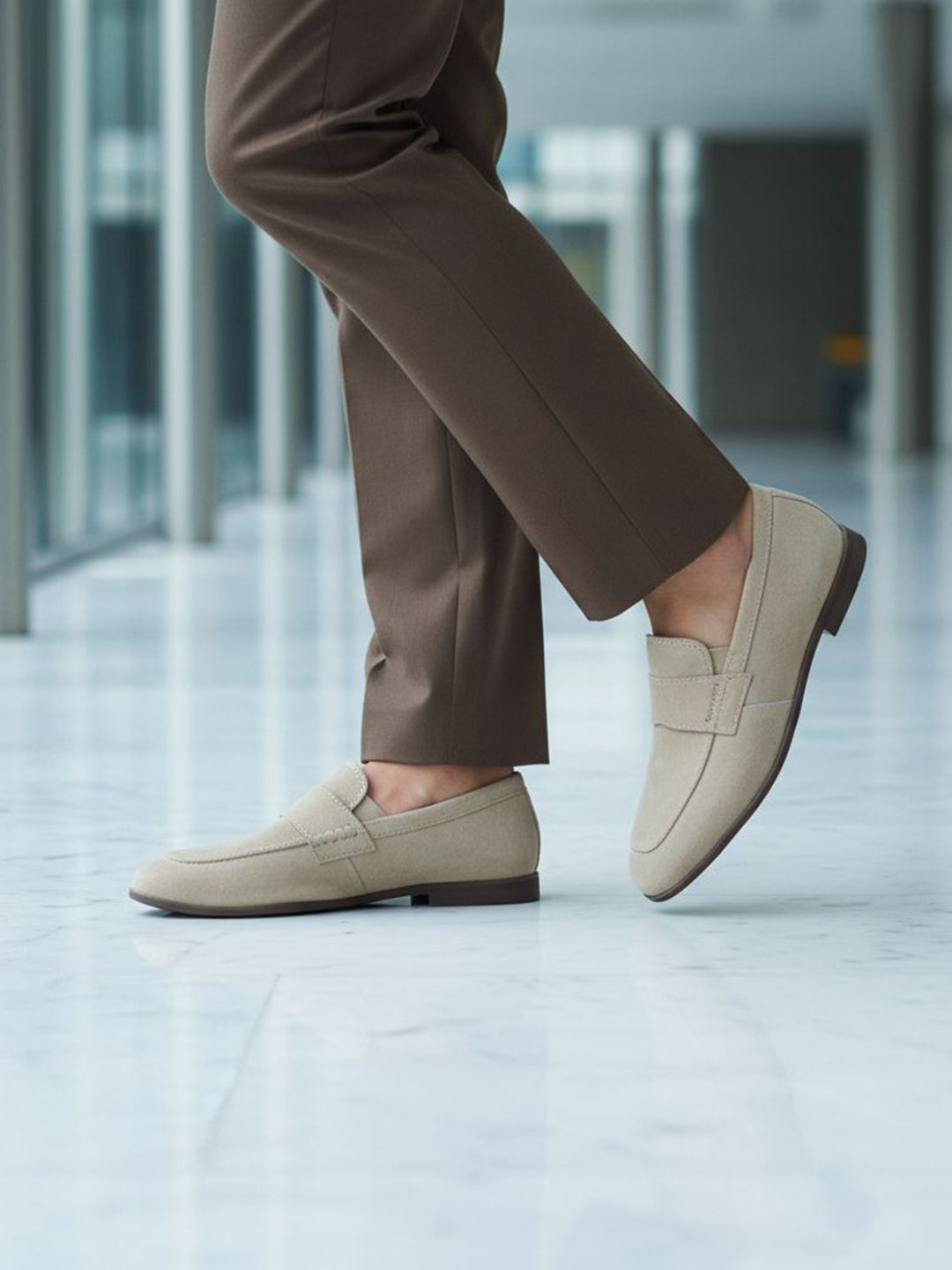 bugatti Tryst sand premium leather comfort penny loafers, beige suede with a dark sole, lifestyle close up.