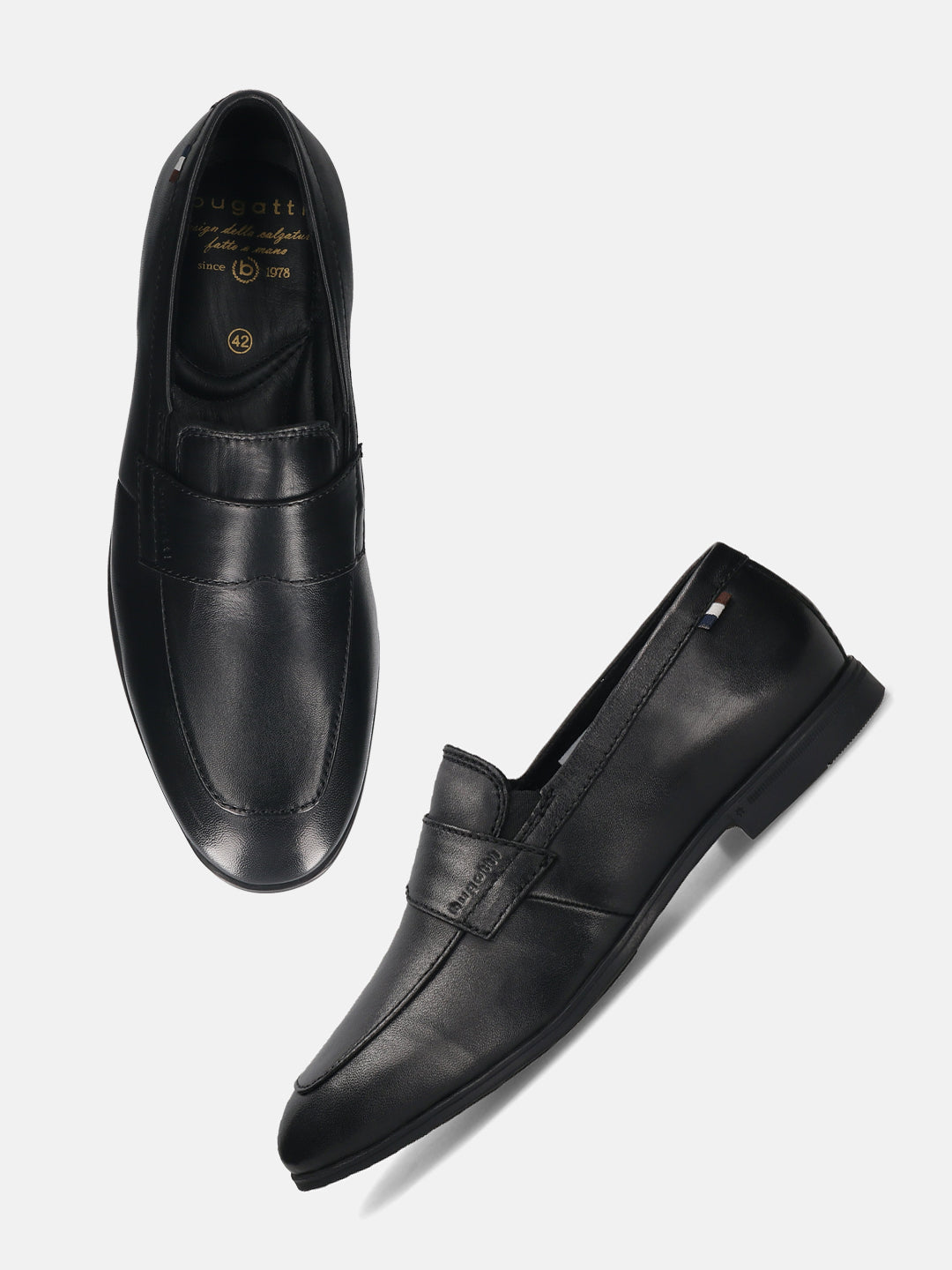 Black leather loafers by bugatti, featuring a penny loafer strap and top stitching.