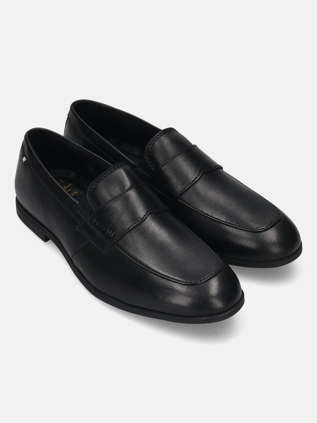 Black leather penny loafers by bugatti with a subtle brand detail on the side and tonal stitching.