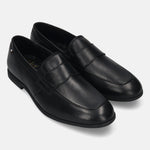 Black leather penny loafers by bugatti with a subtle brand detail on the side and tonal stitching.
