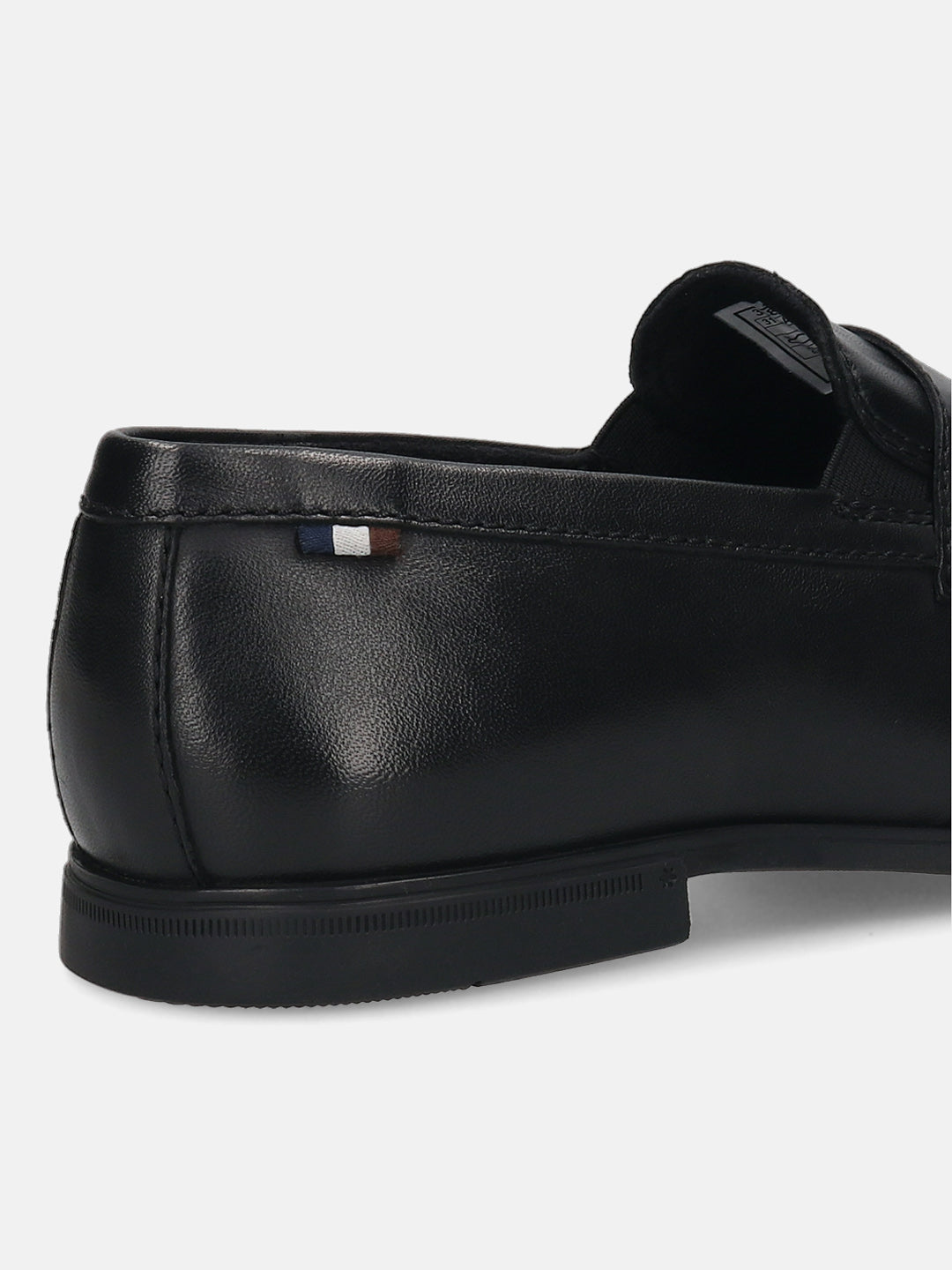 Black leather loafer by bugatti with a penny strap, featuring a striped accent and textured sole, back view.
