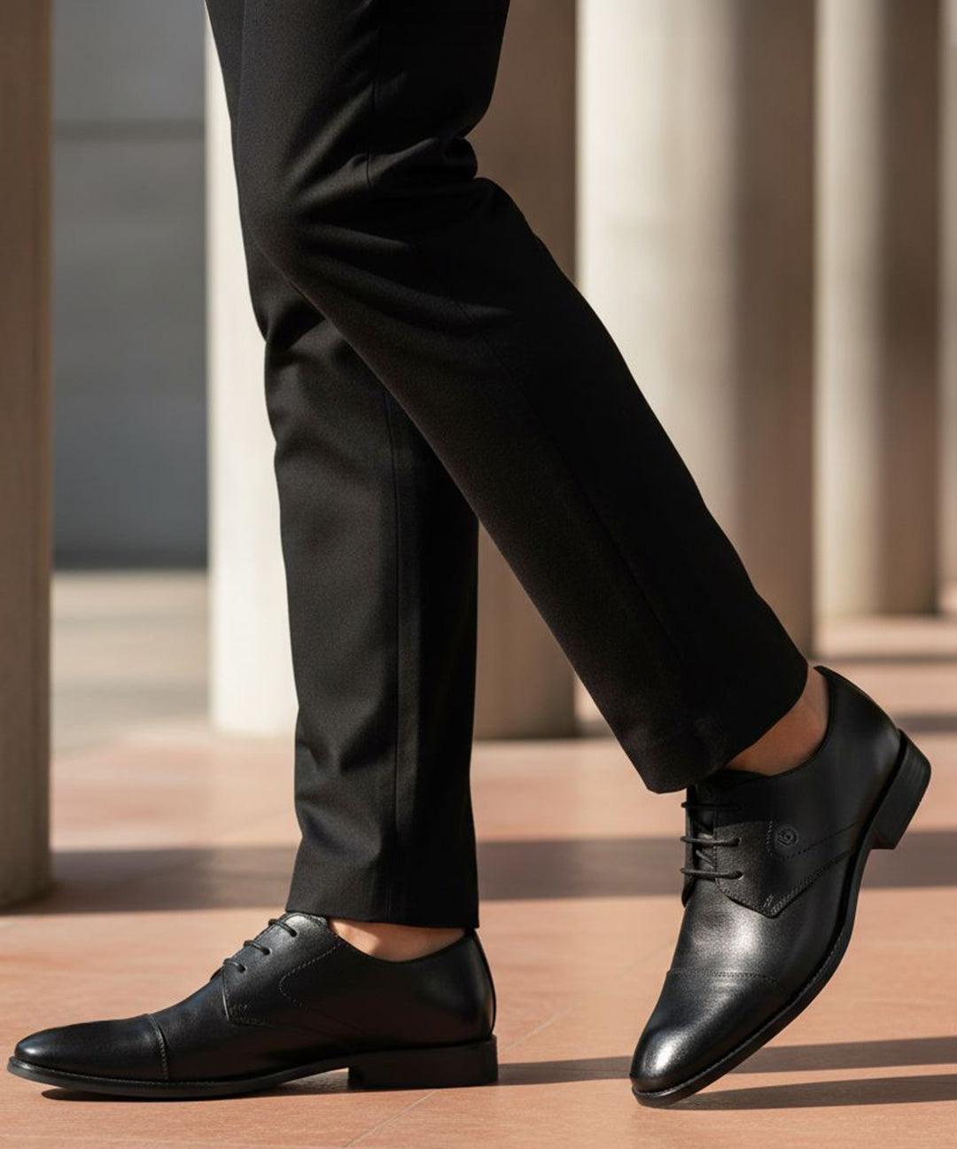 bugatti Rinaldo Eco black premium leather formal shoes, with matching trousers.