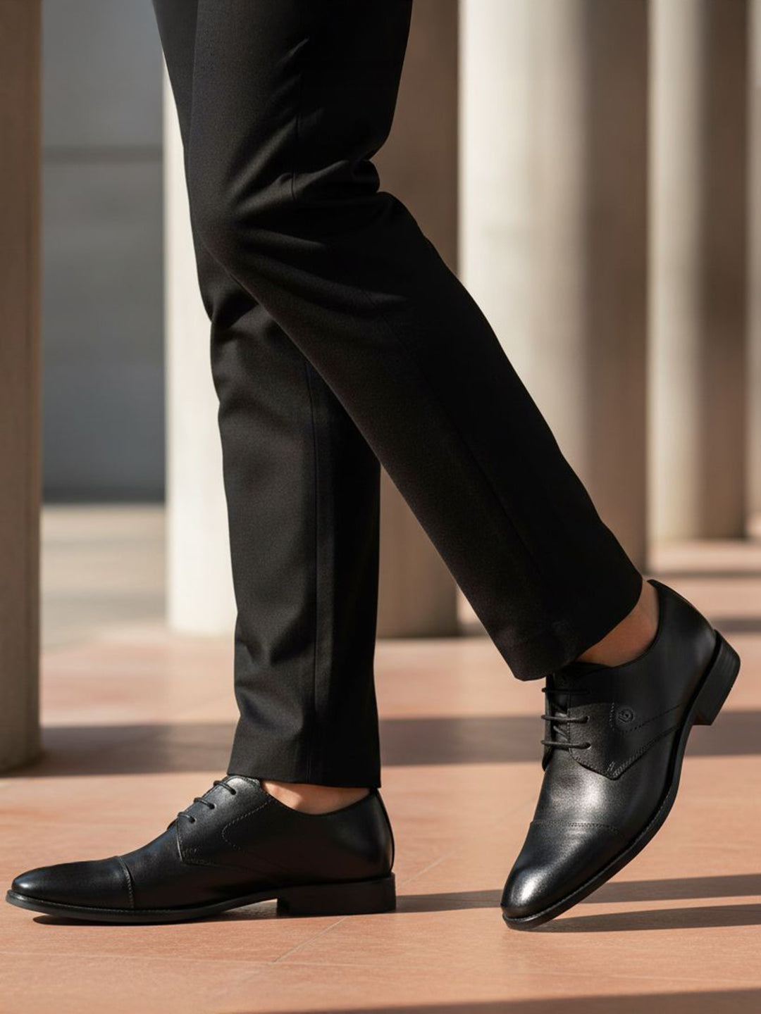 bugatti Rinaldo Eco black premium leather formal shoes, with matching trousers.