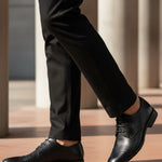 bugatti Rinaldo Eco black premium leather formal shoes, with matching trousers.