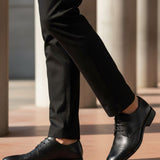 bugatti Rinaldo Eco black premium leather formal shoes, with matching trousers.