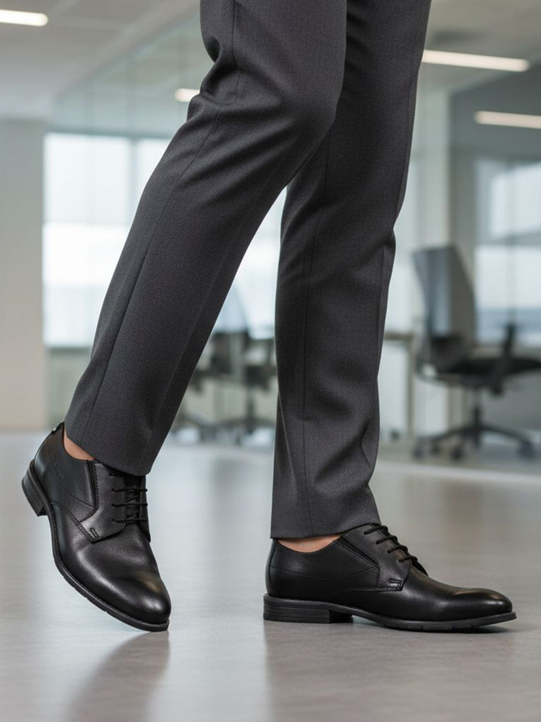 bugatti Lerio Comfort formal shoes in black premium leather, styled with dark grey dress pants.
