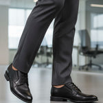 bugatti Lerio Comfort formal shoes in black premium leather, styled with dark grey dress pants.
