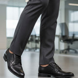 bugatti Lerio Comfort formal shoes in black premium leather, styled with dark grey dress pants.
