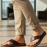 bugatti Limon dark brown premium leather thong sandals, shown on a man wearing beige pants.