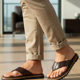 bugatti Limon dark brown premium leather thong sandals, shown on a man wearing beige pants.