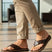 bugatti Limon dark brown premium leather thong sandals, shown on a man wearing beige pants.