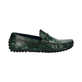 Side view of a green bugatti slip-on shoe with a map-like pattern and dark outsole.

