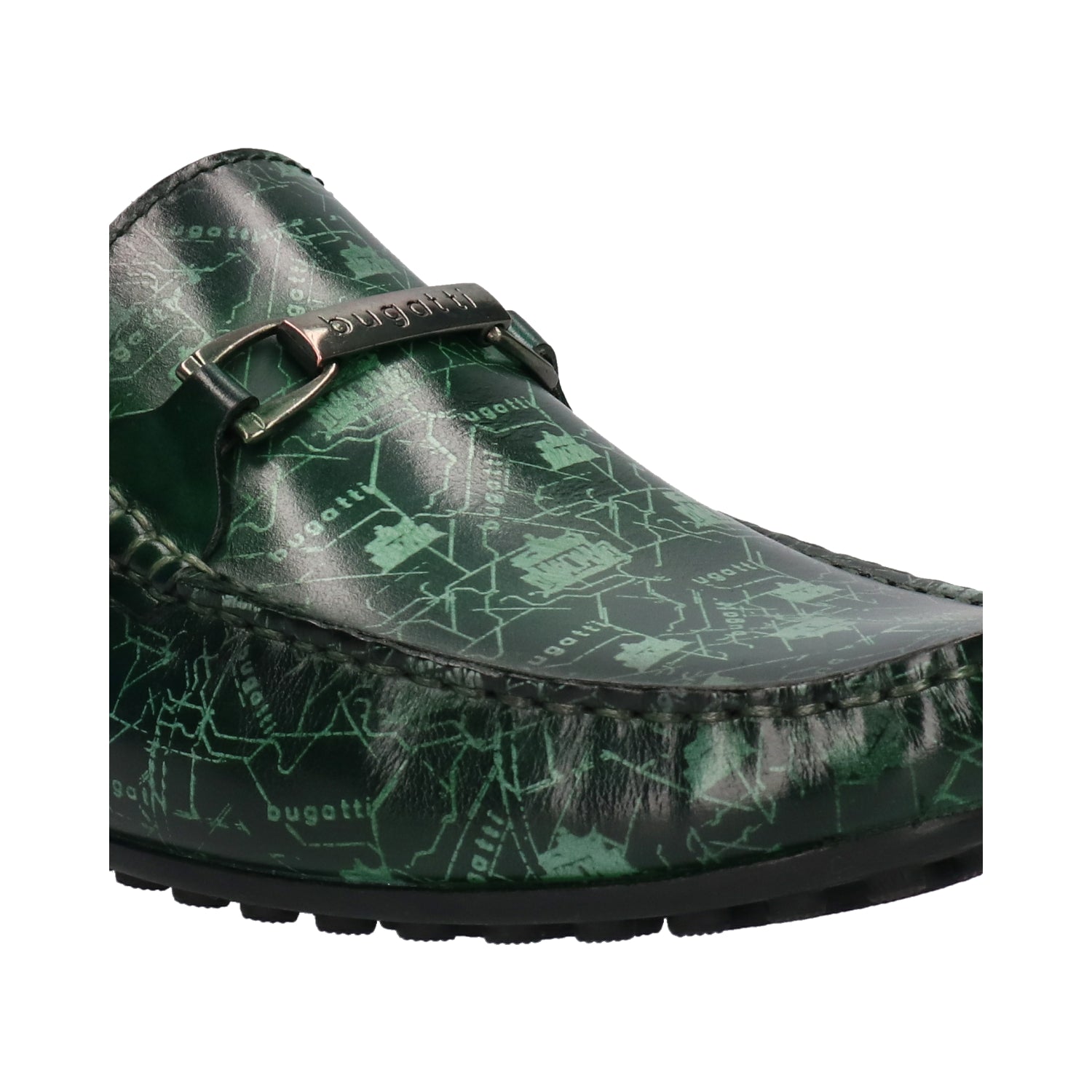 Cropped view of a green leather bugatti loafer with a decorative silver buckle and all-over printed graphic design.
