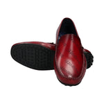 bugatti Tresmo slip-on shoes in dark red premium leather with a repeating logo pattern and cushioned sole.