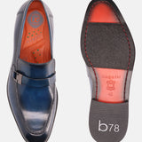 Blue leather penny loafers by Bugatti, shown with orange insole and brand name embossed on the sole.