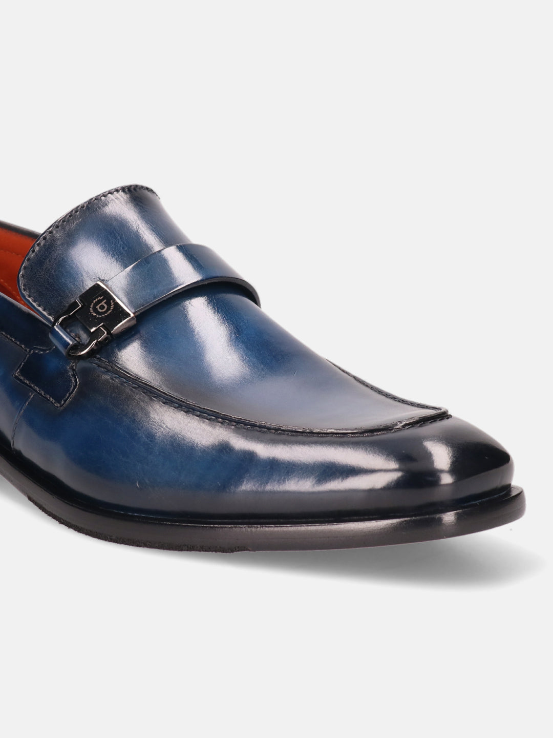 Blue leather penny loafer by bugatti featuring a metal buckle detail and black sole.