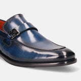 Blue leather penny loafer by bugatti featuring a metal buckle detail and black sole.