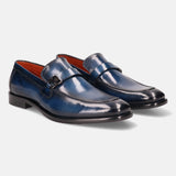 Blue leather penny loafers by bugatti with a metal accent on the strap and bright orange lining.