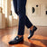 bugatti Mansueto Flex Blue premium leather penny loafers with a silver buckle, worn with navy slacks.