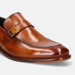 A cognac Men's bugatti Penny Loafer featuring a round plain toe, stacked heel. Made from premium genuine leather with a durable leather outsole, this slip-on design offers both style and comfort.