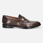 Dark green leather penny loafer by Bugatti, featuring a metal accent, and low heel, in a side view.