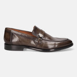 Dark green leather penny loafer by Bugatti, featuring a metal accent, and low heel, in a side view.