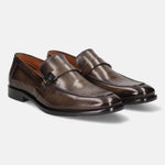 Dark green leather penny loafers by bugatti, featuring a sleek and polished finish.