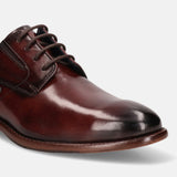 A grey Men's bugatti Derby featuring a round plain toe, stacked heel. Made from premium genuine leather with a durable leather outsole, this laces design offers both style and comfort.