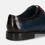 A blue Men's bugatti Derby featuring a round toe wing tip, stacked heel. Made from premium genuine leather with a durable leather outsole, this laces design offers both style and comfort.